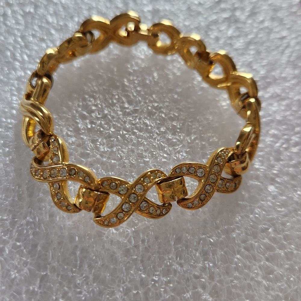 NAPIER SIGNED GOLD TONE CRYSTALS INFINITY BRACELET